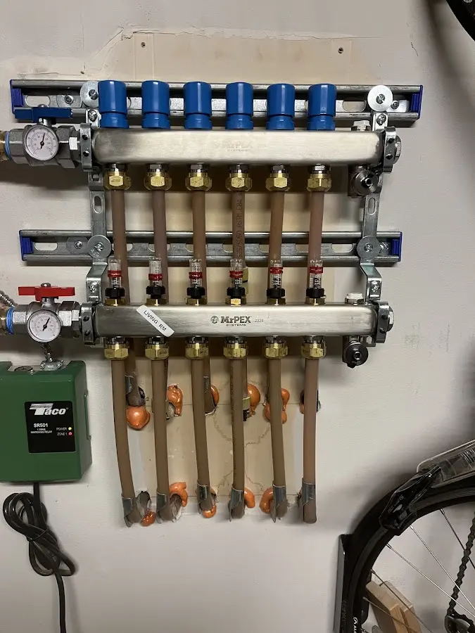 Plumber performing Water Heater Repair at a residential property in Poteet